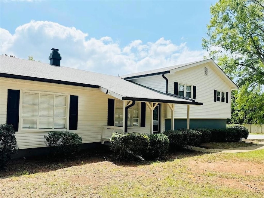 View of home's exterior featuring a chimney
