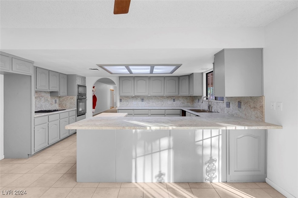 Kitchen with breakfast bar and eating area with sl