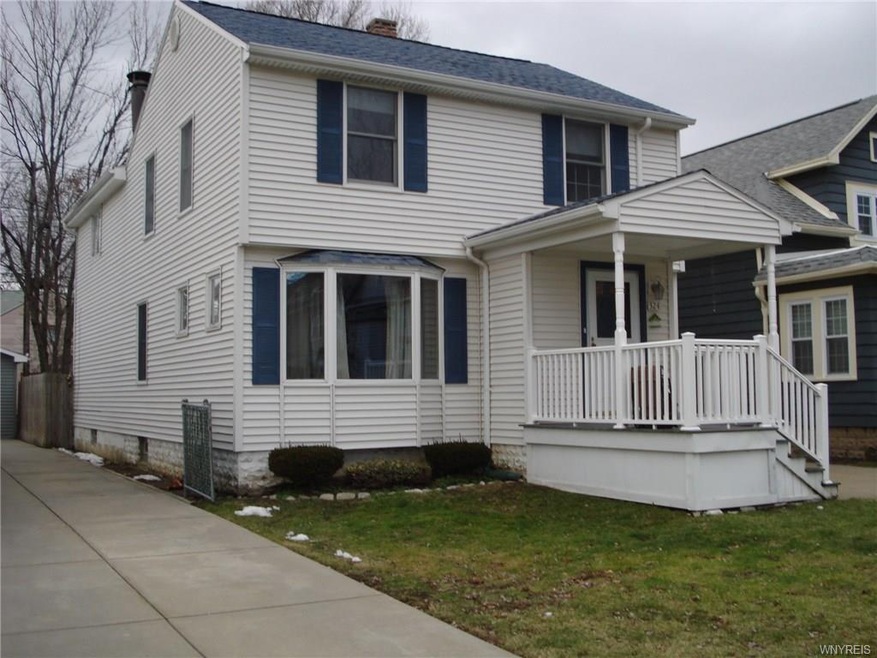 Front of house from neighbors driveway.  Maintenan