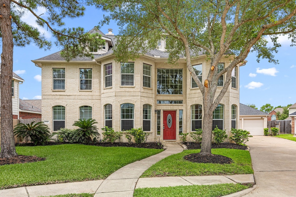 Fantastic curb appeal with gorgeous front yard