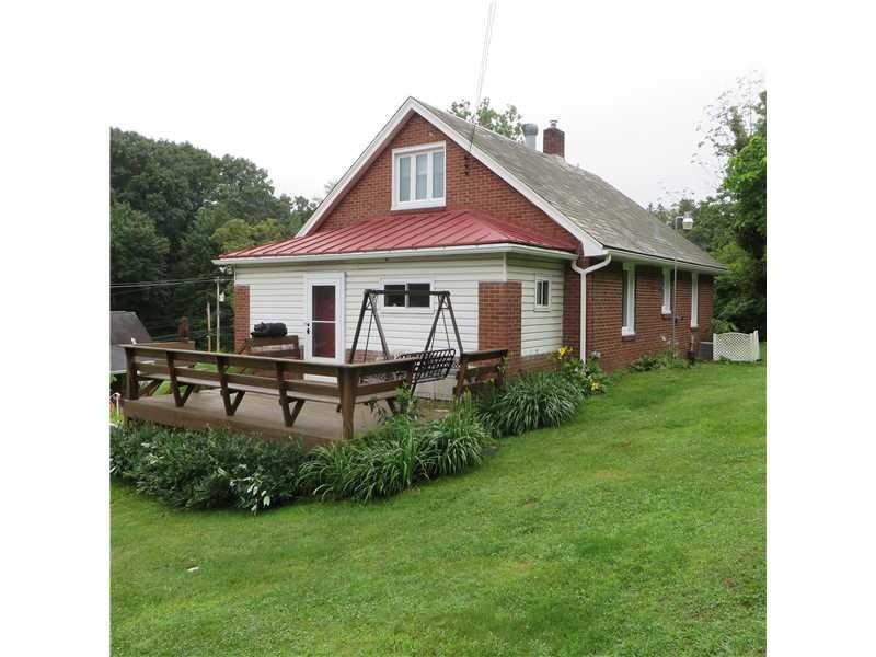 Exterior Front. Charming Brick home with Slate Roo