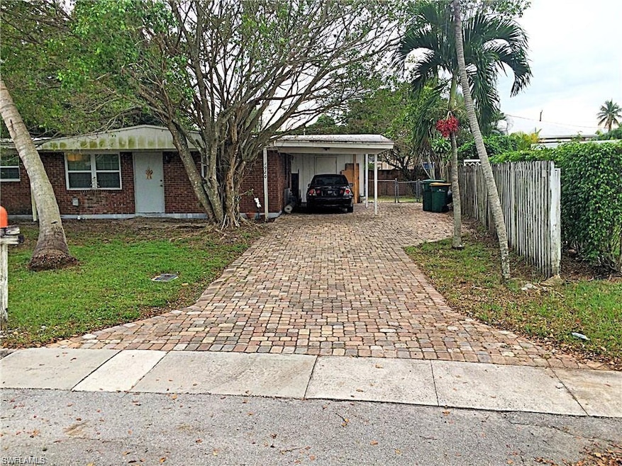 Front of the house, carport and brick driveway