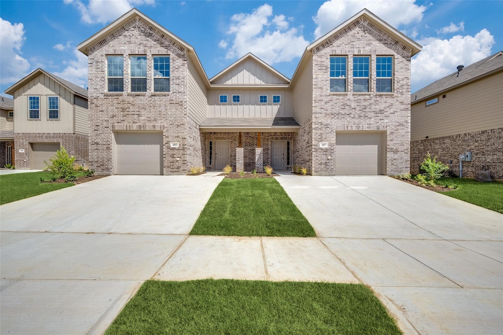 View of front of property featuring a garage
