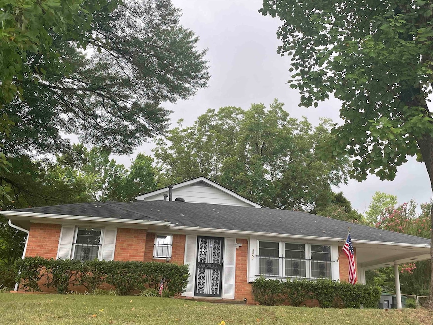 Single story home with a front yard