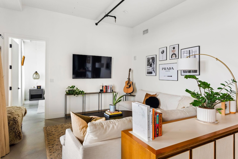Living room featuring concrete flooring