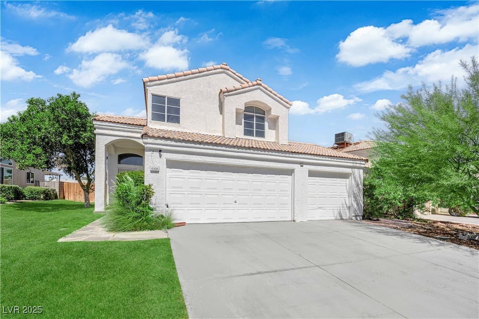 Mediterranean / spanish-style home with a tiled roof, concrete driveway, stucco siding, and an attached garage