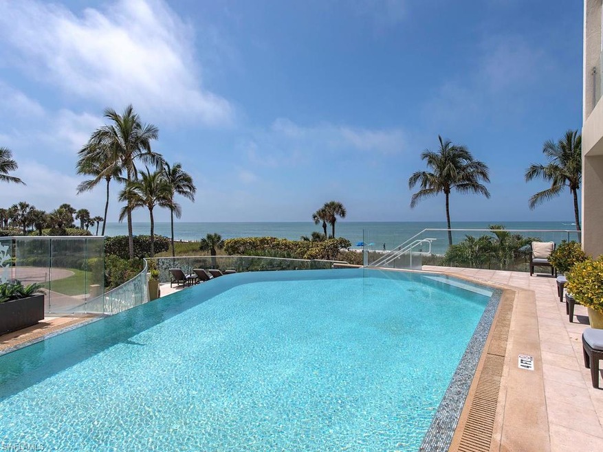 Serene pool with spa overlooking the Gulf of Mexic