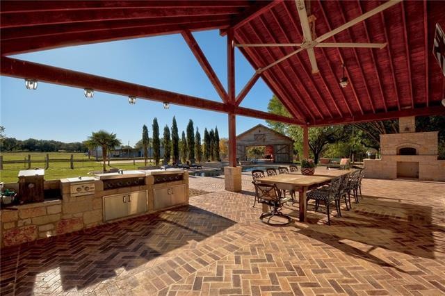 Gorgeous and massive covered outdoor space adjacent to pool and party barn
