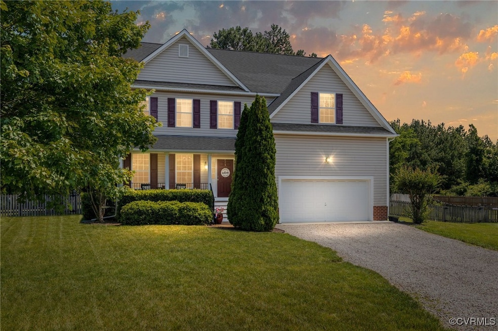 Traditional-style home with gravel driveway and a