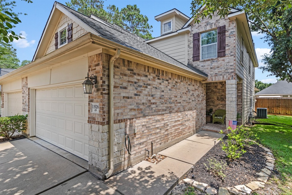 Lovely two-story townhome with large Gameroom and fenced backyard.