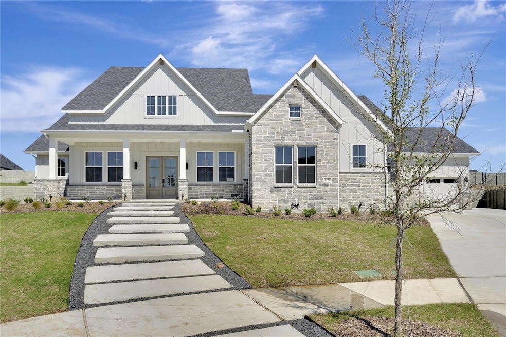 Craftsman-style house featuring a garage, a porch,