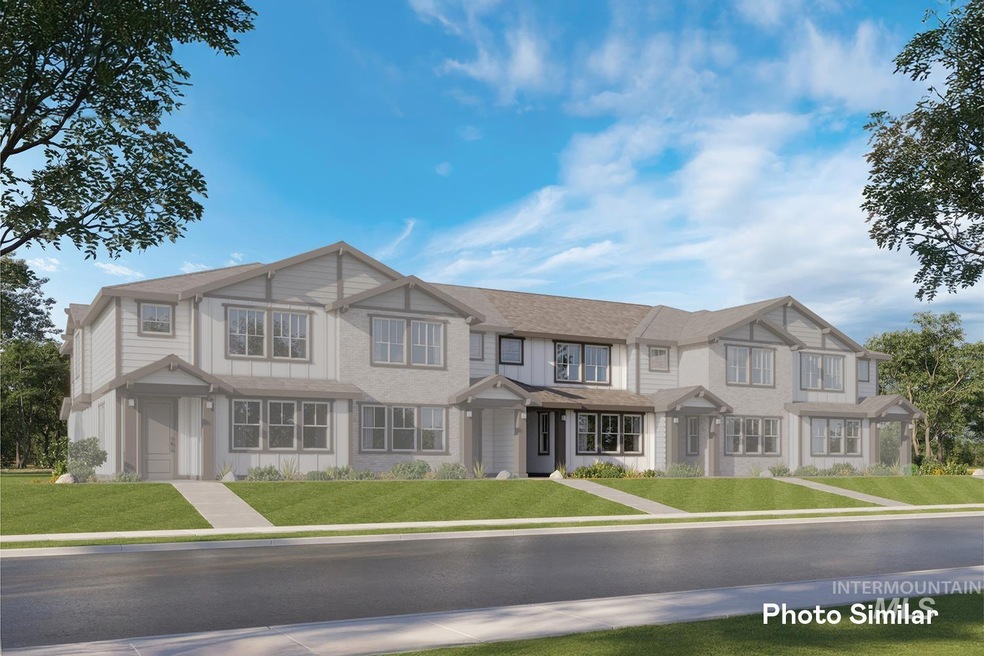 Townhome / multi-family property with a front yard