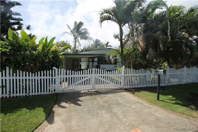 Welcoming front of home with white picket fence an