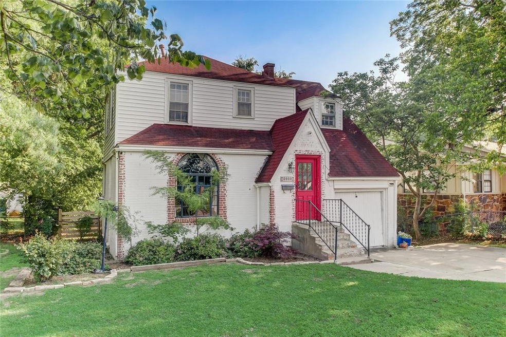 View of front of property featuring a garage and a