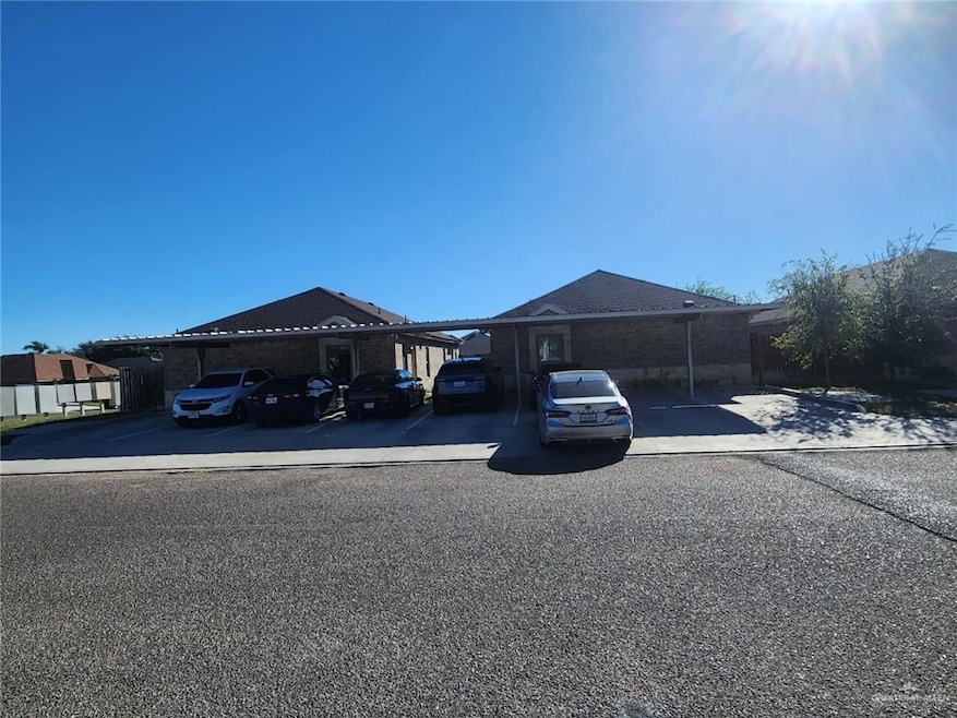View of front of house with covered parking