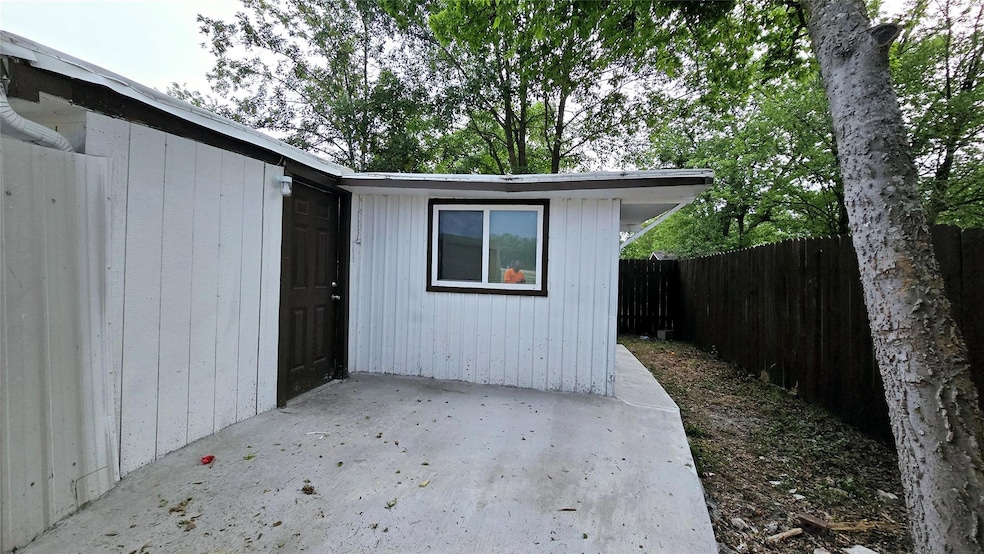 Entrance to property featuring a patio area and f