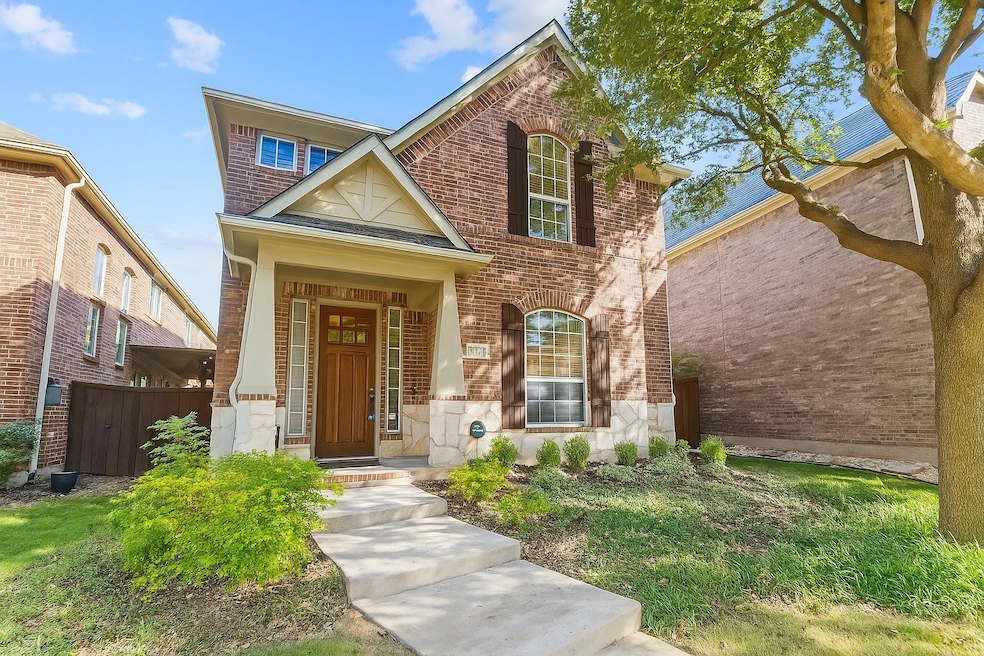 View of front facade with brick siding and stone siding