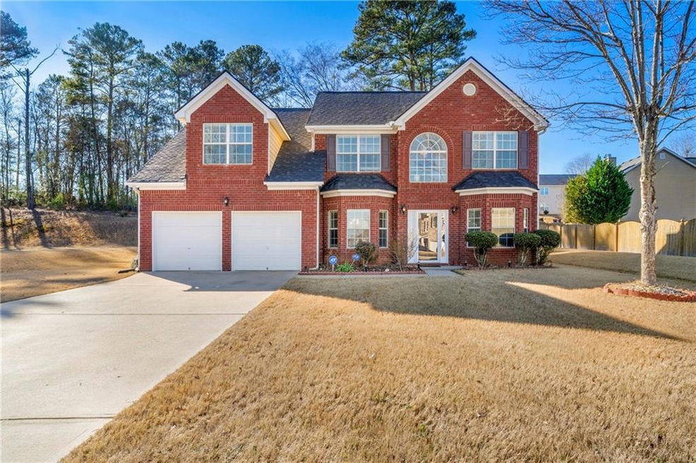 View of front of house featuring a garage and a fr