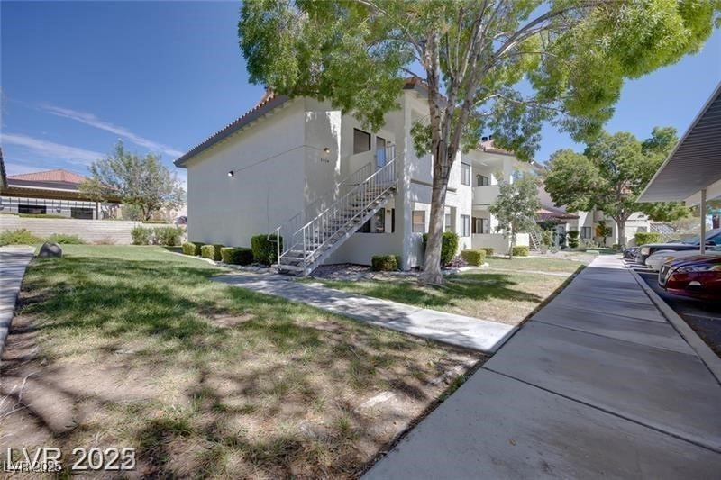 View of property exterior featuring stucco siding,