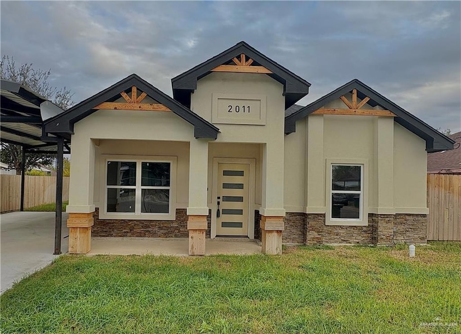 View of front facade with stone siding and stucco siding