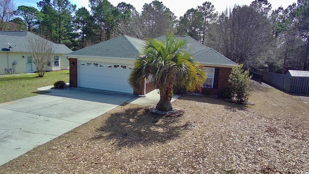 Single story home featuring a garage