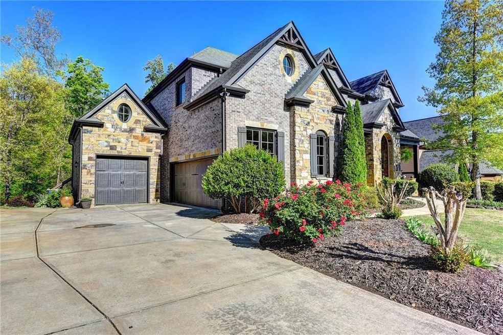 Extra wide driveway and 3 car garage provides plen