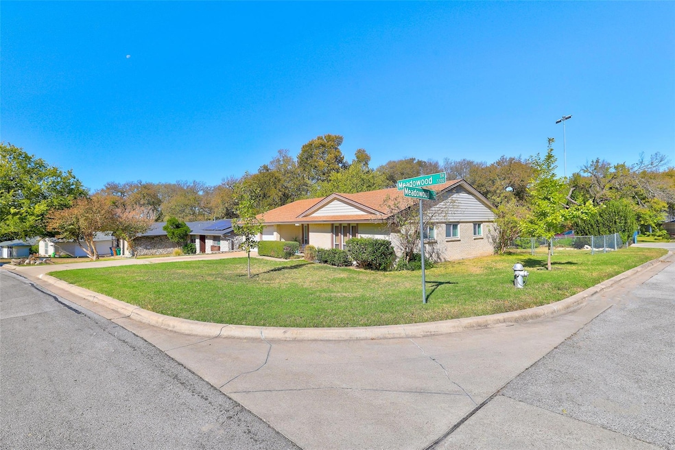 This charming home sits on a large, beautiful corner, cul-de-sac lot!