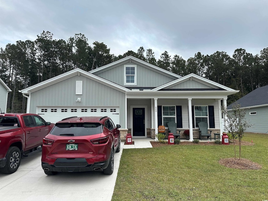 Craftsman-style home with covered porch, a garage,