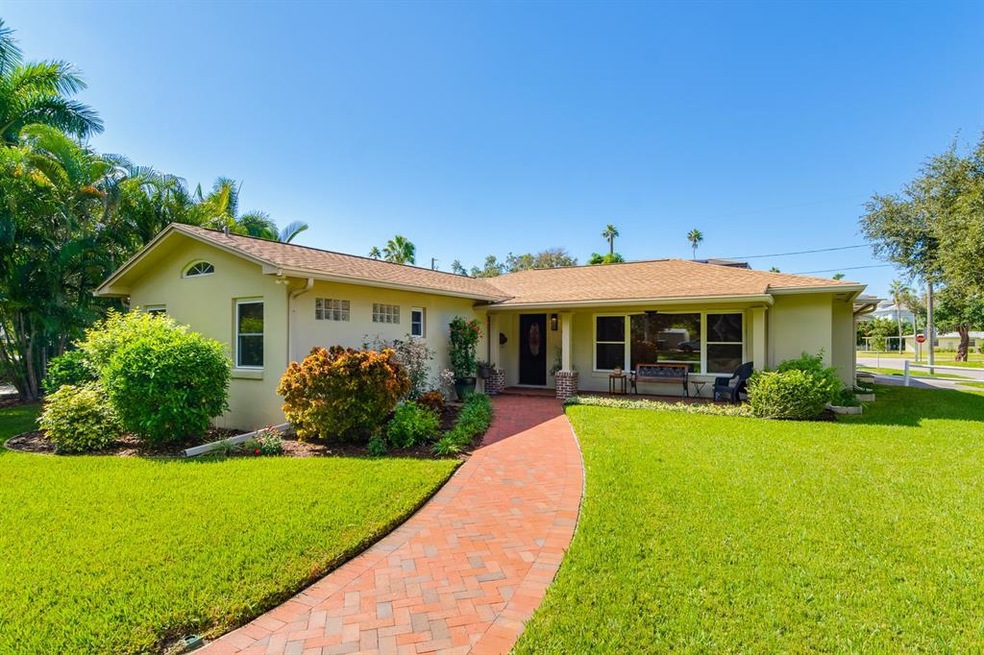 Brick walkway into front of home