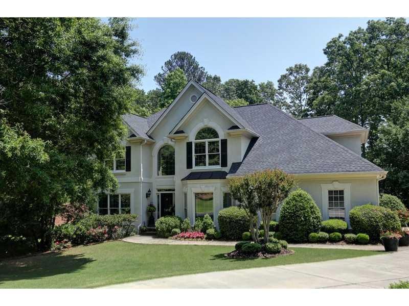 Exterior Front. Professionally landscaped yard.