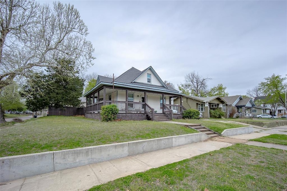 View of front of property with covered porch and a
