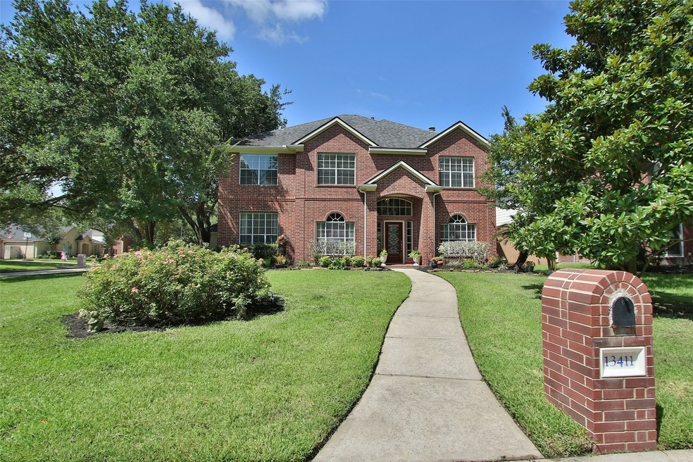 The large lot of this property is the first to welcome guests of 13411 Pin Oak Glen Ln to the home. Flanked by a couple shade trees with plenty of space to branch out.