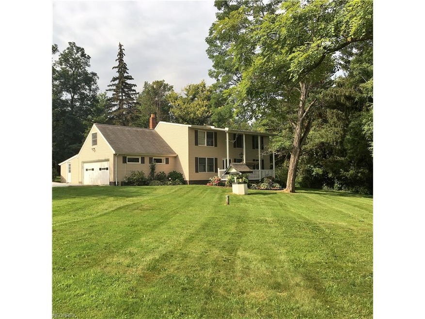 Stately colonial sets well back from the road on a