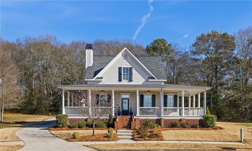Farmhouse-style home featuring covered porch