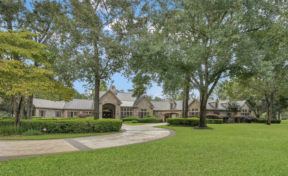 Welcome home to 4.8 acres of tranquility in the ex