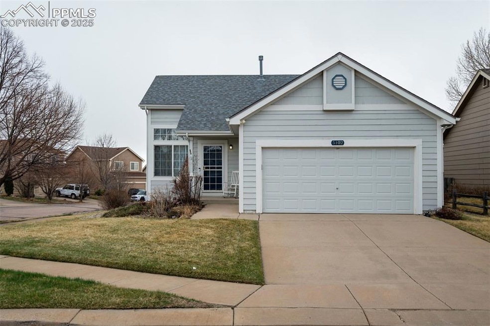 View of front facade featuring a front lawn, drive