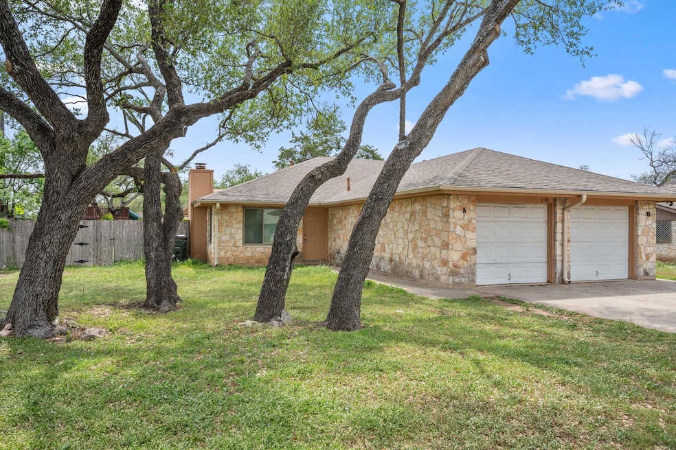 Ranch-style home featuring driveway, a front yard