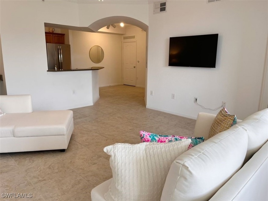 Living room featuring light tile patterned floors