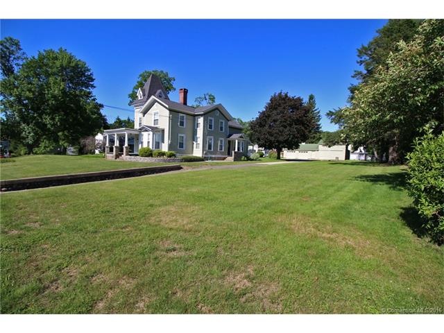 Stunning Victorian on .88 acres with huge garage &