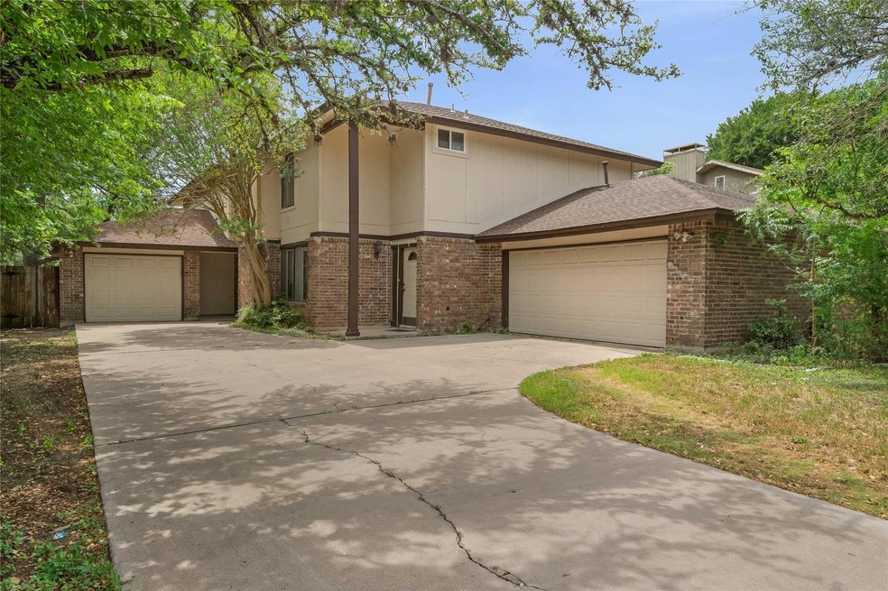 View of front of house with brick siding, concret
