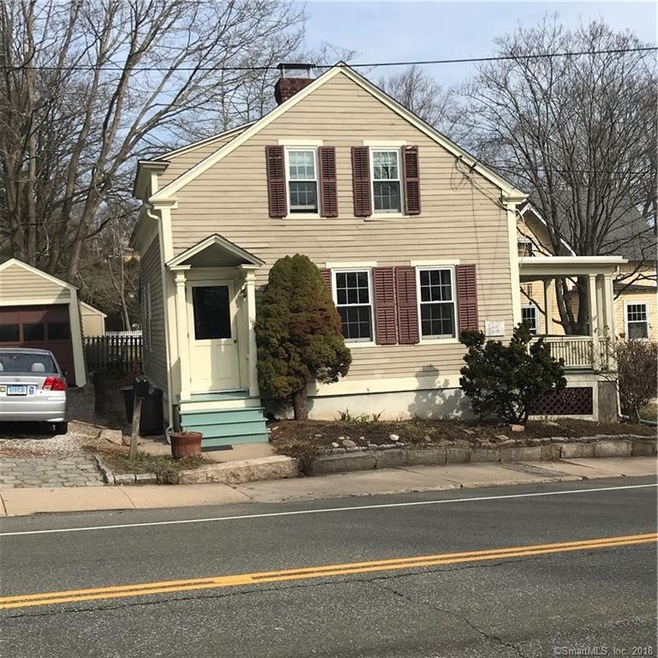 One car garage on left and porch on right side.