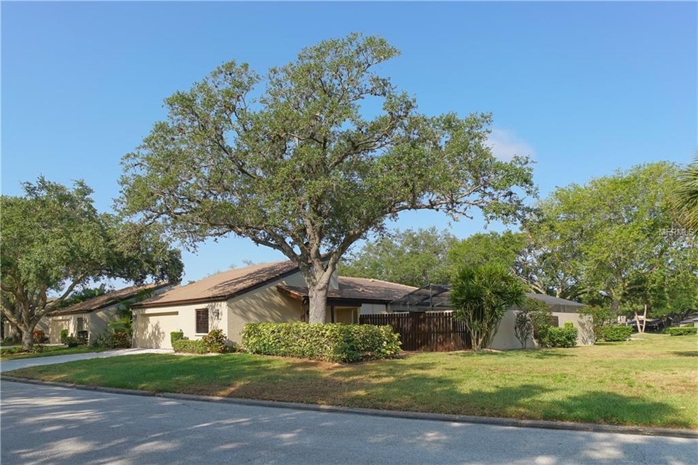 End Unit on large corner lot with plenty of green 