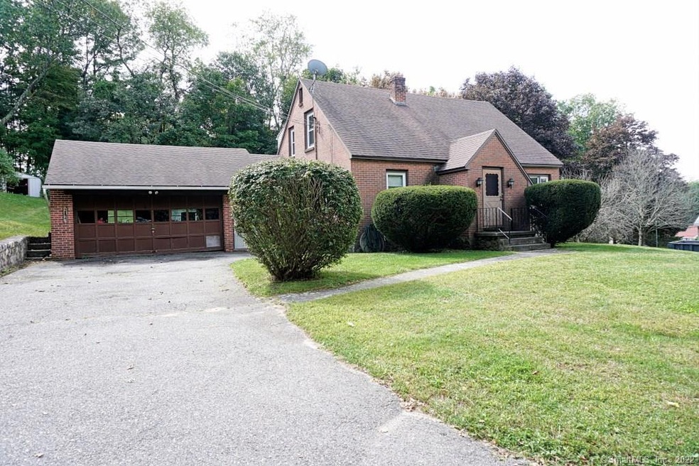 Front exterior shows 2 car garage with large drive