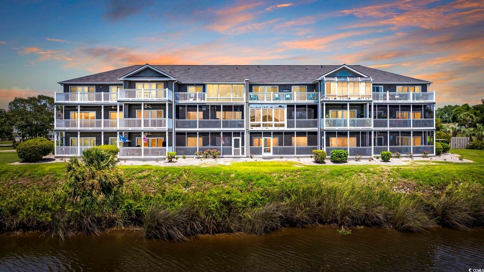 Outdoor building at dusk featuring a water view