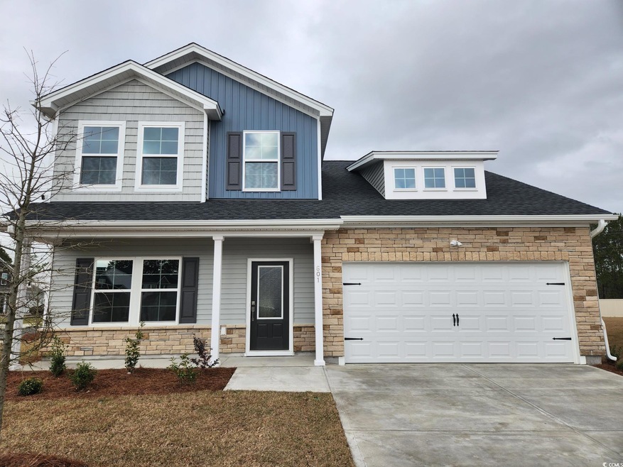 Craftsman-style home with stone siding, an attache