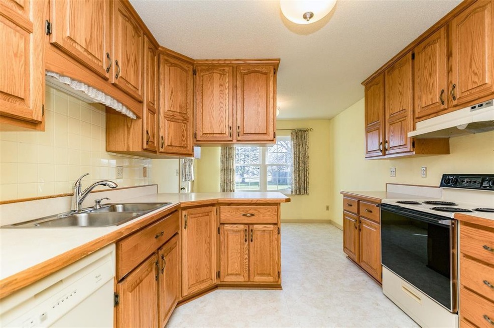 Spacious eat-in kitchen with beveled oak counter t