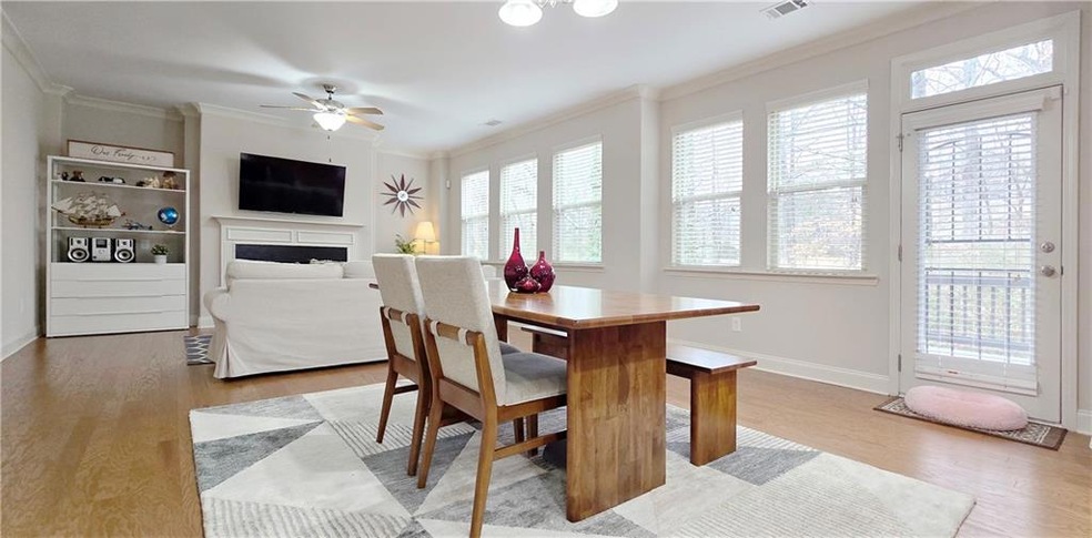 Dining area with ceiling fan, light hardwood / woo