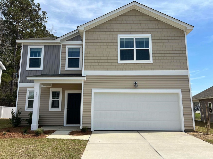 Traditional home with board and batten siding and 
