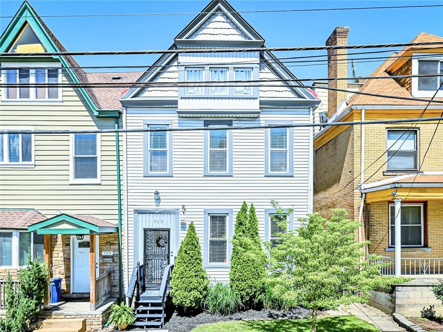 This spacious & updated three story Victorian, loc