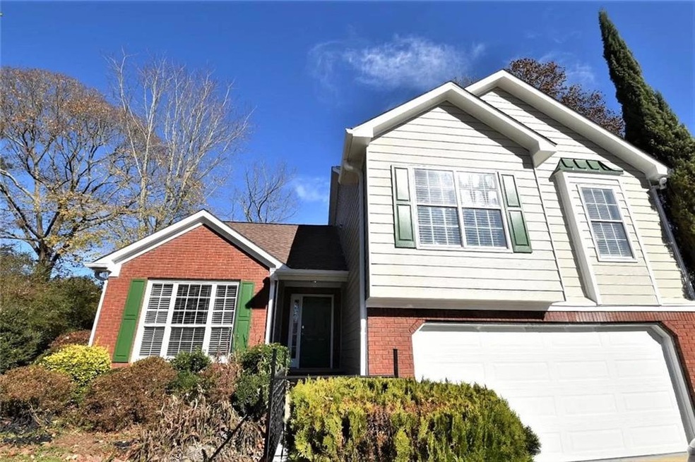View of front of property featuring a garage